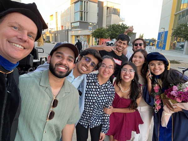 Picture of Laura after graduation with current and former Jensen lab members